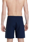model wearing mens ben carlson 18.5" straight in navy showing back side and yellow accent stitching