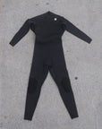 front view of men's 3M front chest full body wetsuit while laying on ground. I P D circle logo on left shoulder with zipper running across chest from left to right side.