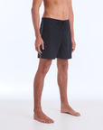 The B100 Chase boardshort features a 16” length and solid black coloring with a black and white striped side taping. It also has a waistband tie, side zipper pocket, and a black IPD logo patch halfway up the left leg taping.
