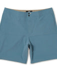 The front view of blue shorts with two side pockets, two metal snaps at the closure, and a small circular I P D logo to the left of the snaps. The waistband has two double rows of stitching. There is also double stitching along the edges of a horizontal rectangular section located below the waist, above the crotch and extending to the left and right side seams.