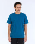 The Foundation Super Soft Tee is our comfortable super soft tee in blue with no logo or branding besides a small square side flag on the ____ seam.