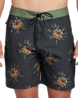 Black boardshorts with green trim and floral pattern front.