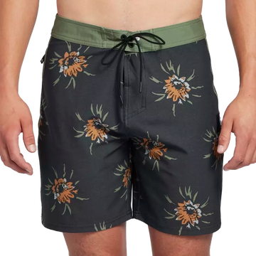 Black boardshorts with green trim and floral pattern front.