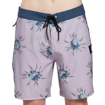 Black boardshorts with green trim and floral pattern front.