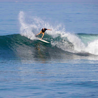 jason coming off a frontside snap on the lip of a nice looking wave