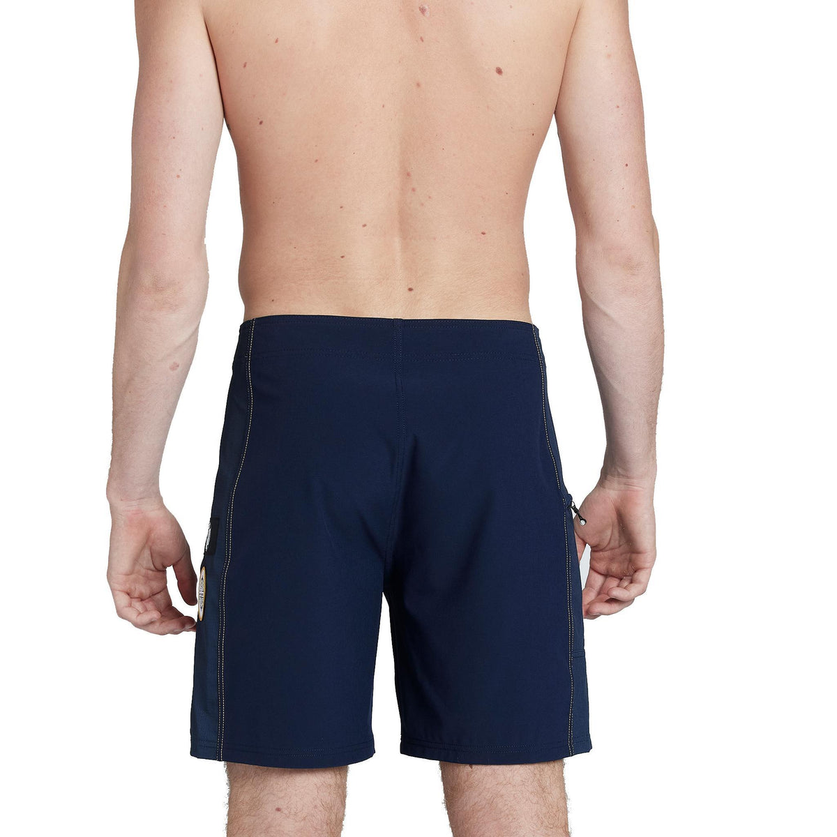 model wearing mens ben carlson 18.5&quot; straight in navy showing back side and yellow accent stitching 