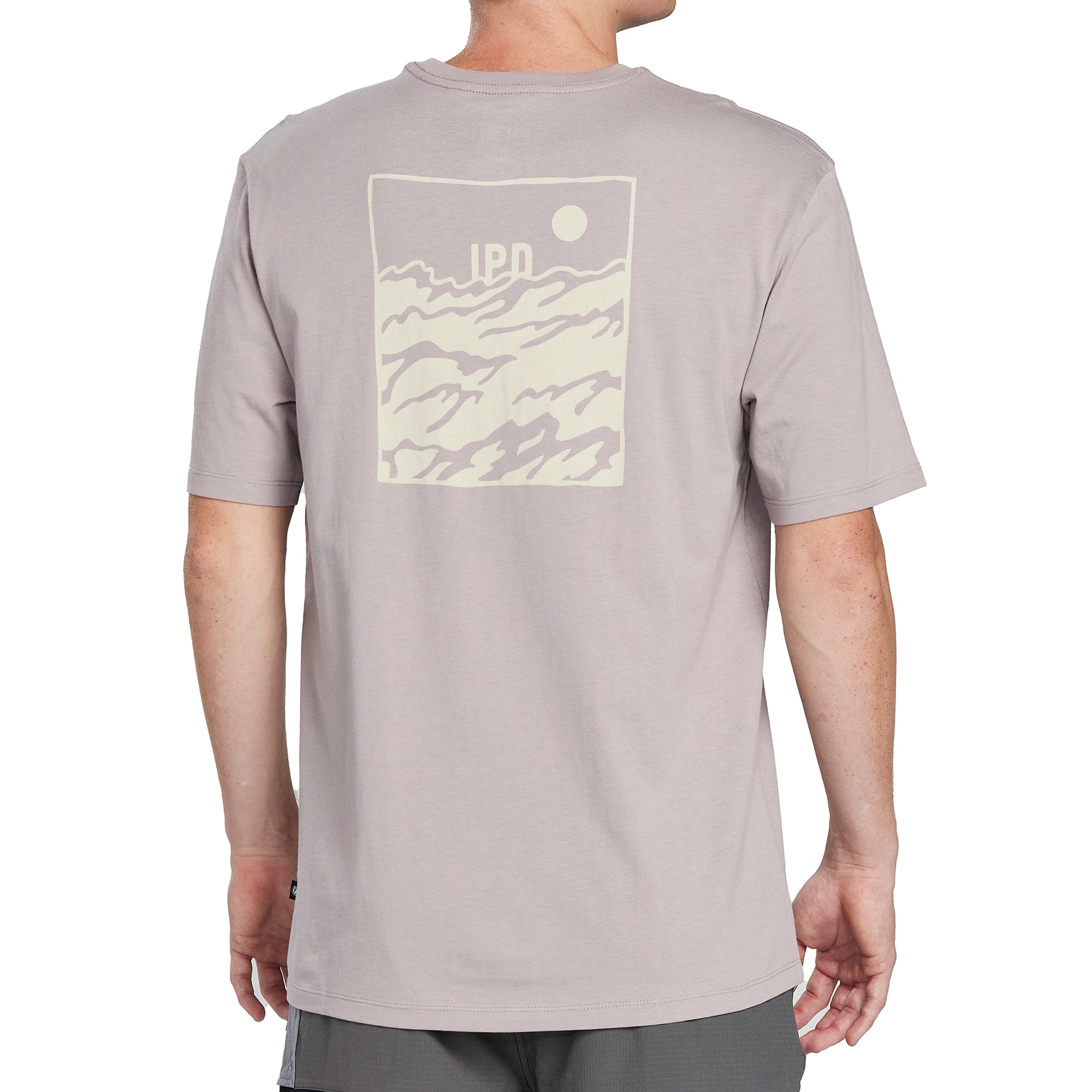 Back of a moonstone gray short sleeve tee with a large, light mineral green rectangular framed print of choppy water with the letters I P D above the water and a circular sun in the top right corner of the frame.