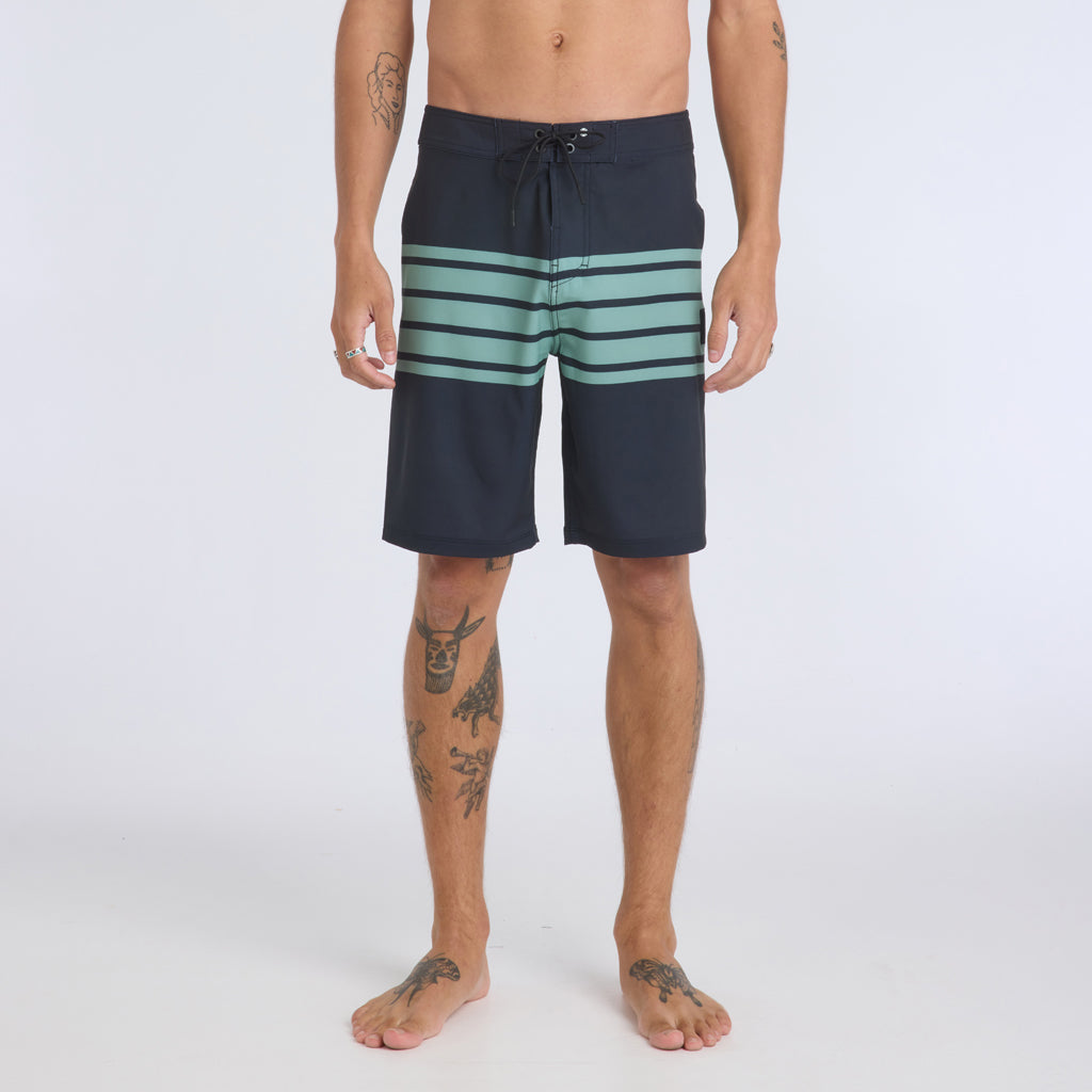 Front view of navy blue boardshorts with 5 turquoise stripes running across the center of the shorts.