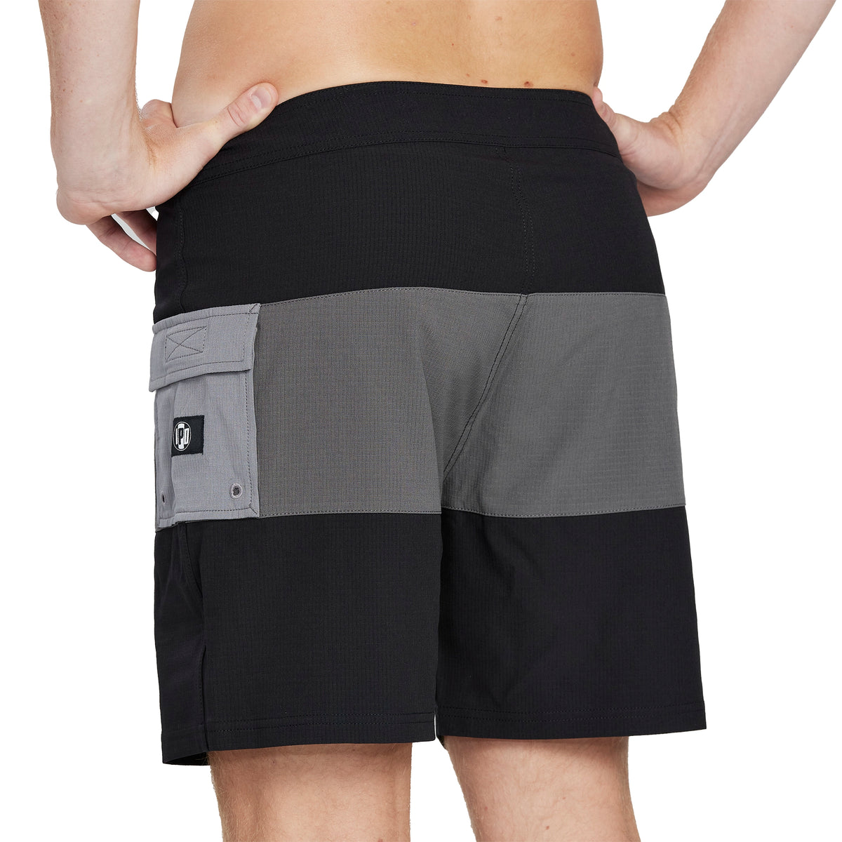 black and gray boardshorts  taken from back 