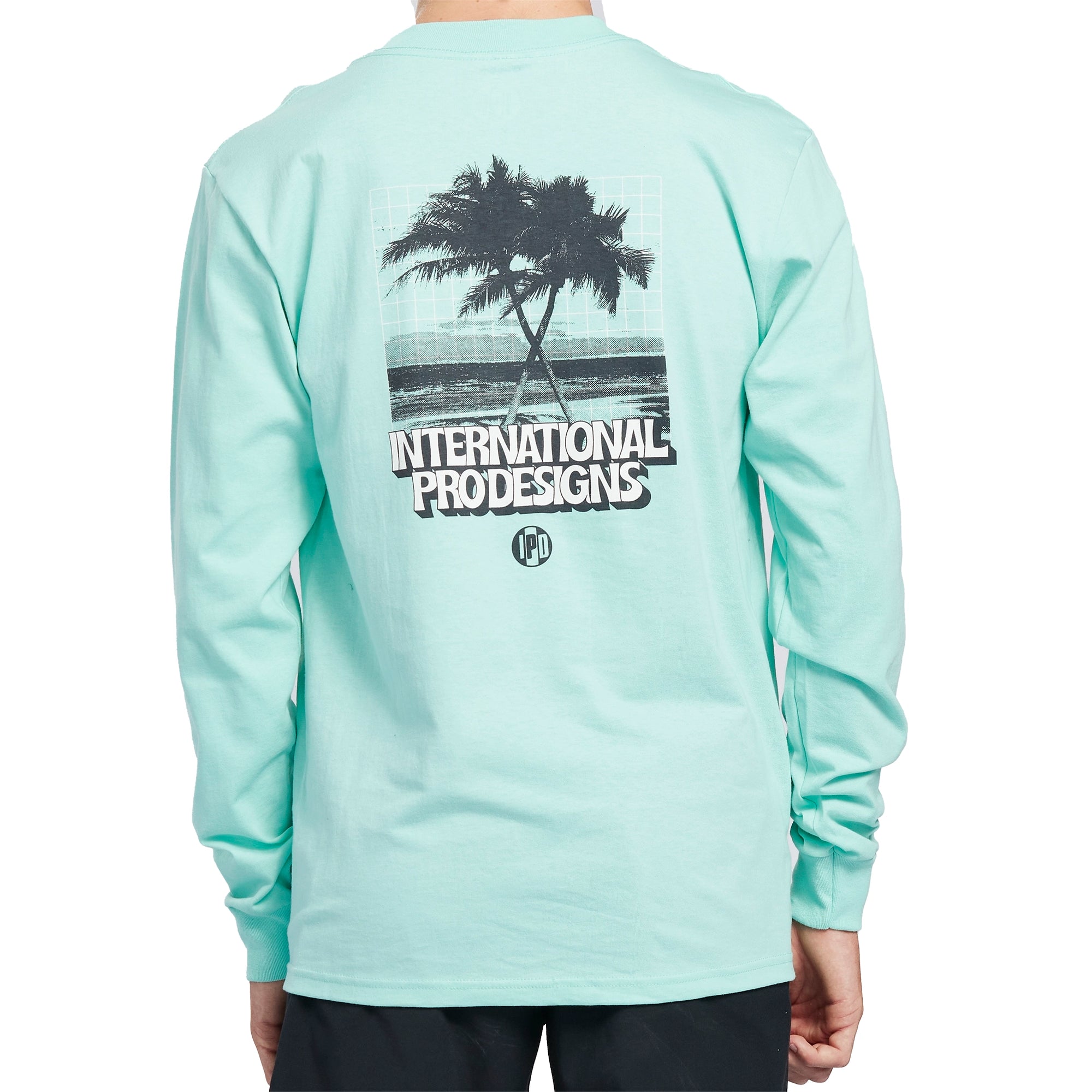 Vintage white long sleeve tee with a print of crossing palm trees on a beach on the back.