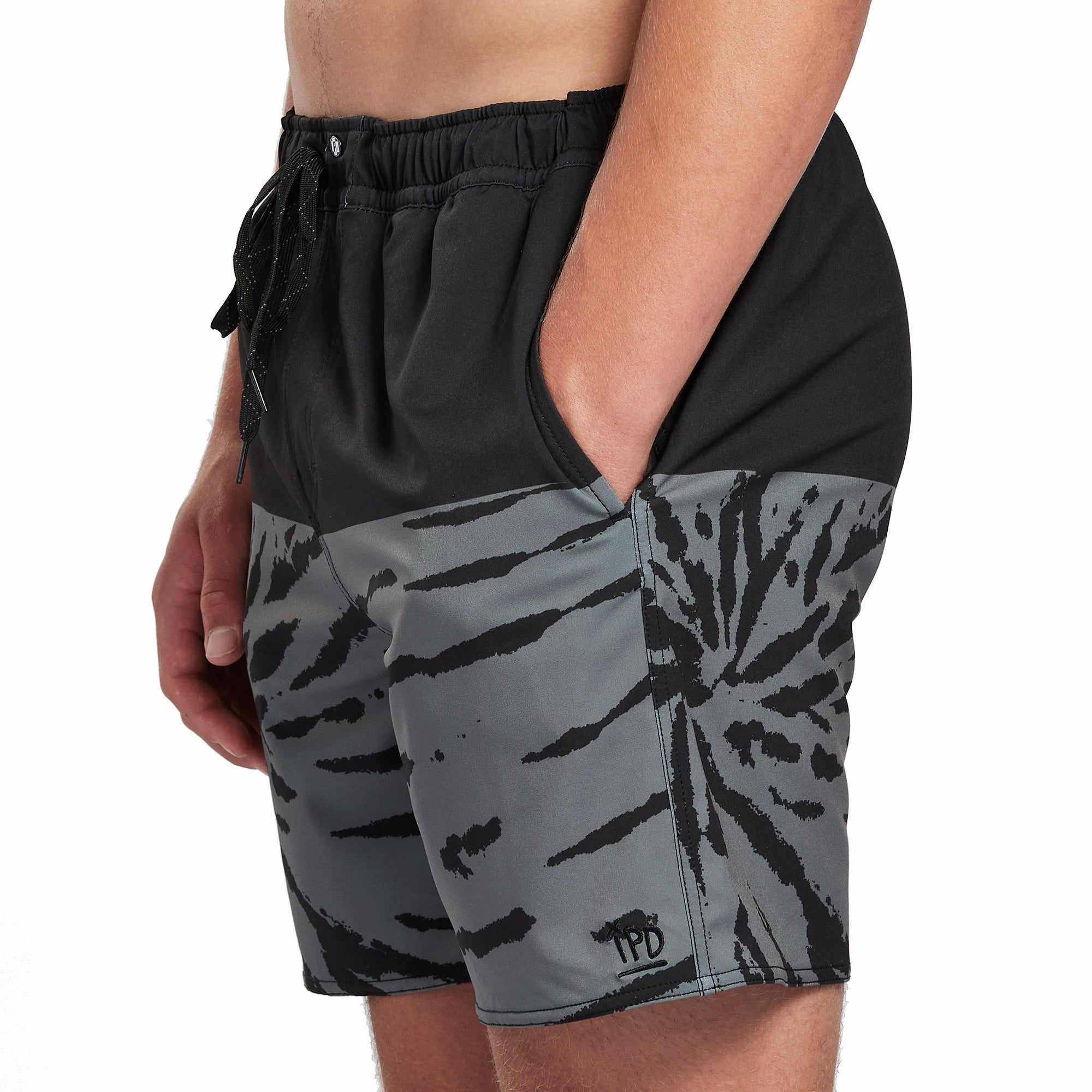 Black boardshorts with a gray swirl pattern front view.