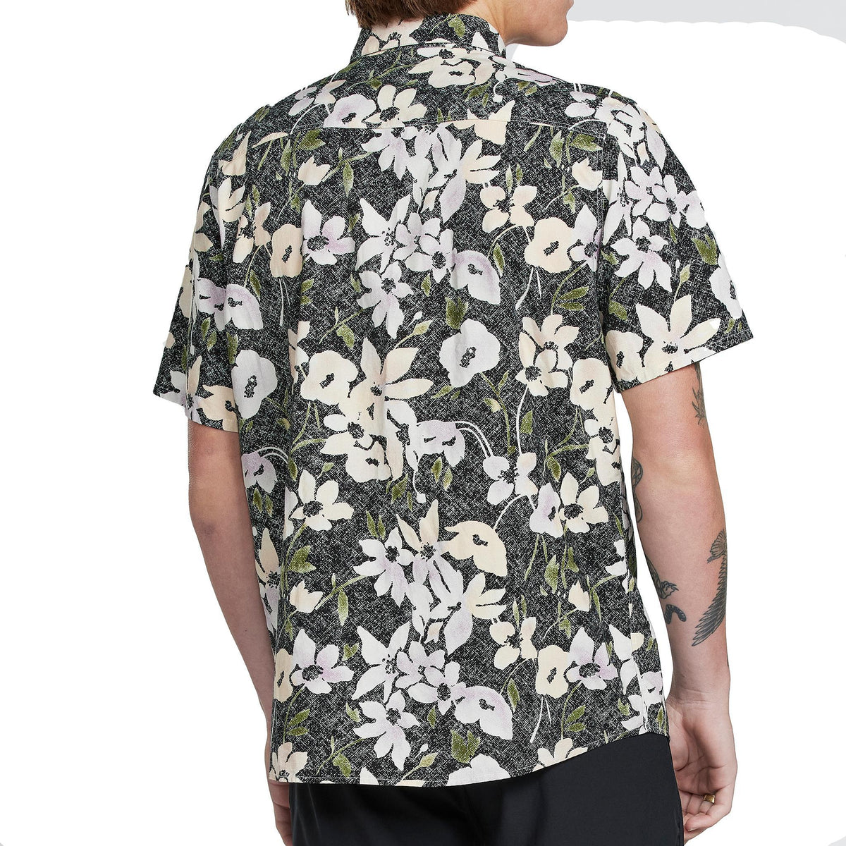 Back view of a men&#39;s short sleeve floral button-down shirt. The vibrant floral pattern continues from the front to the back against a light background. The shirt is neatly tailored and features a classic collar. This stylish garment is suitable for casual occasions during warm weather.