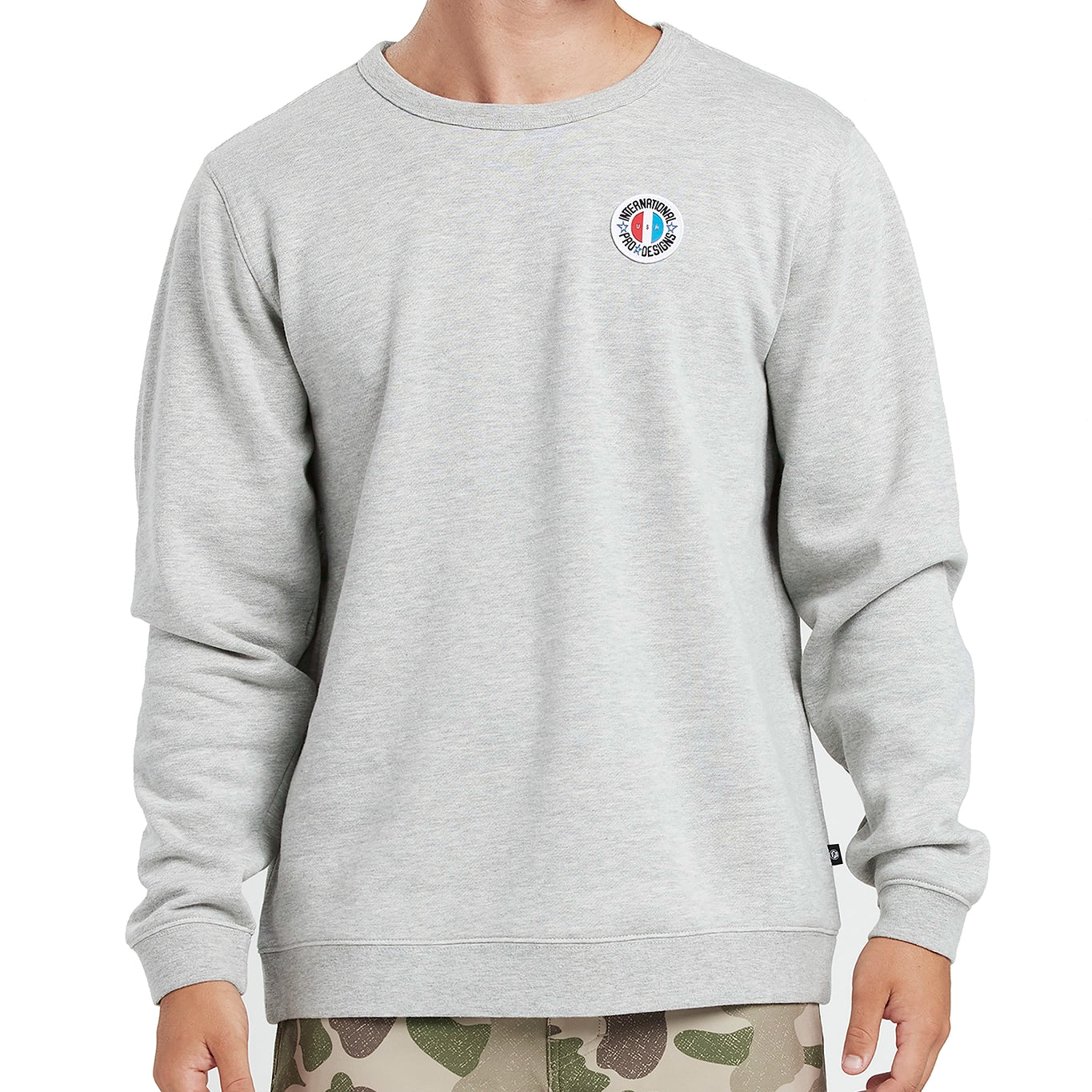 model wearing Heather grey mens Americana pullover showing front view, with multicolor I P D logo on left chest