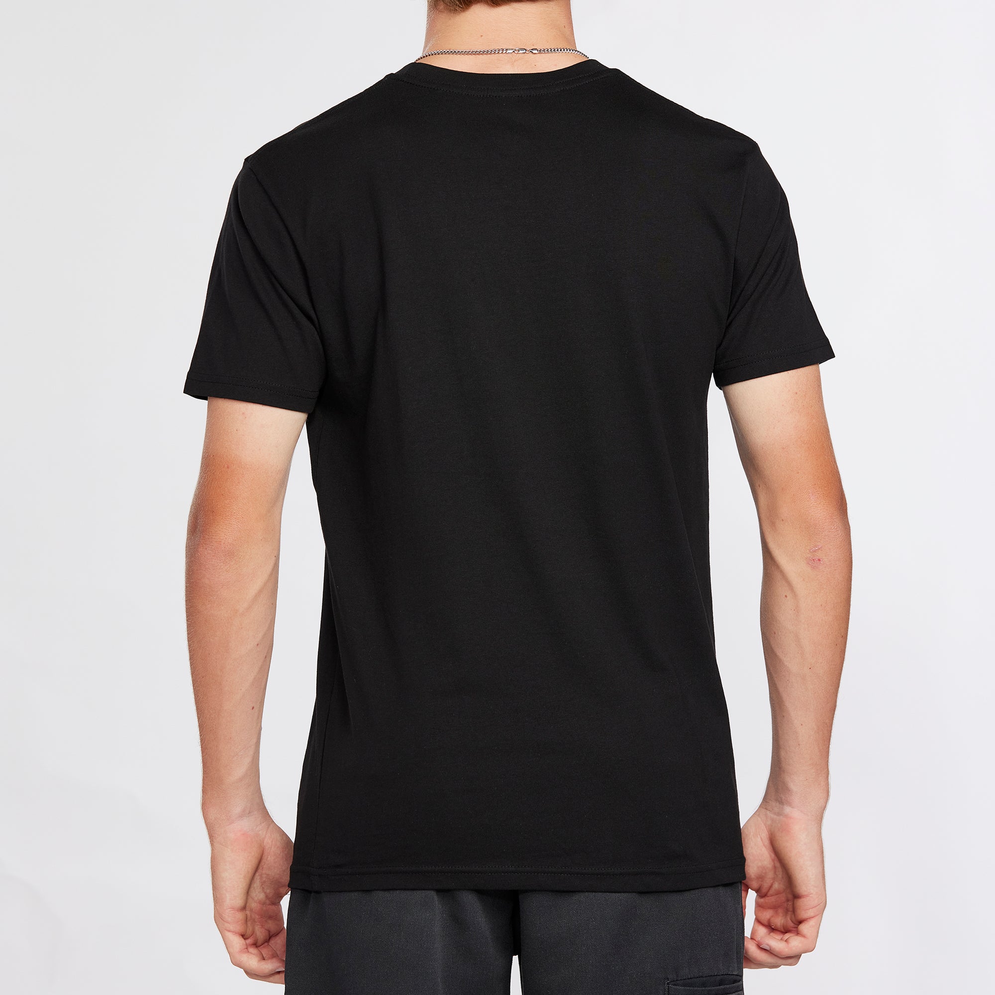 Back view of a black graphic tee with a clean, solid design, offering a comfortable fit and versatile style.
