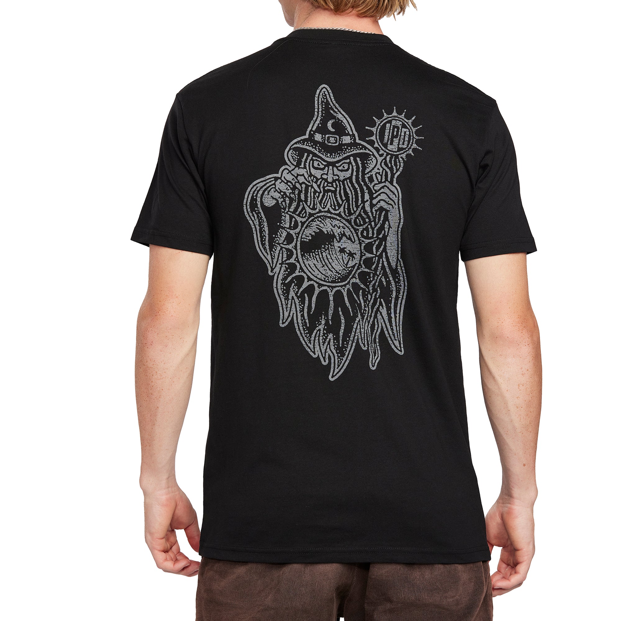 Back view of a black graphic tee featuring an intricate wizard holding a wave design, blending mystical and surf-inspired elements.
