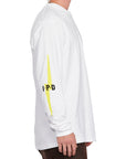 Side view of white Bolt Longsleeve tee showing the yellow lightning bolt on the sleeve with IPD text.