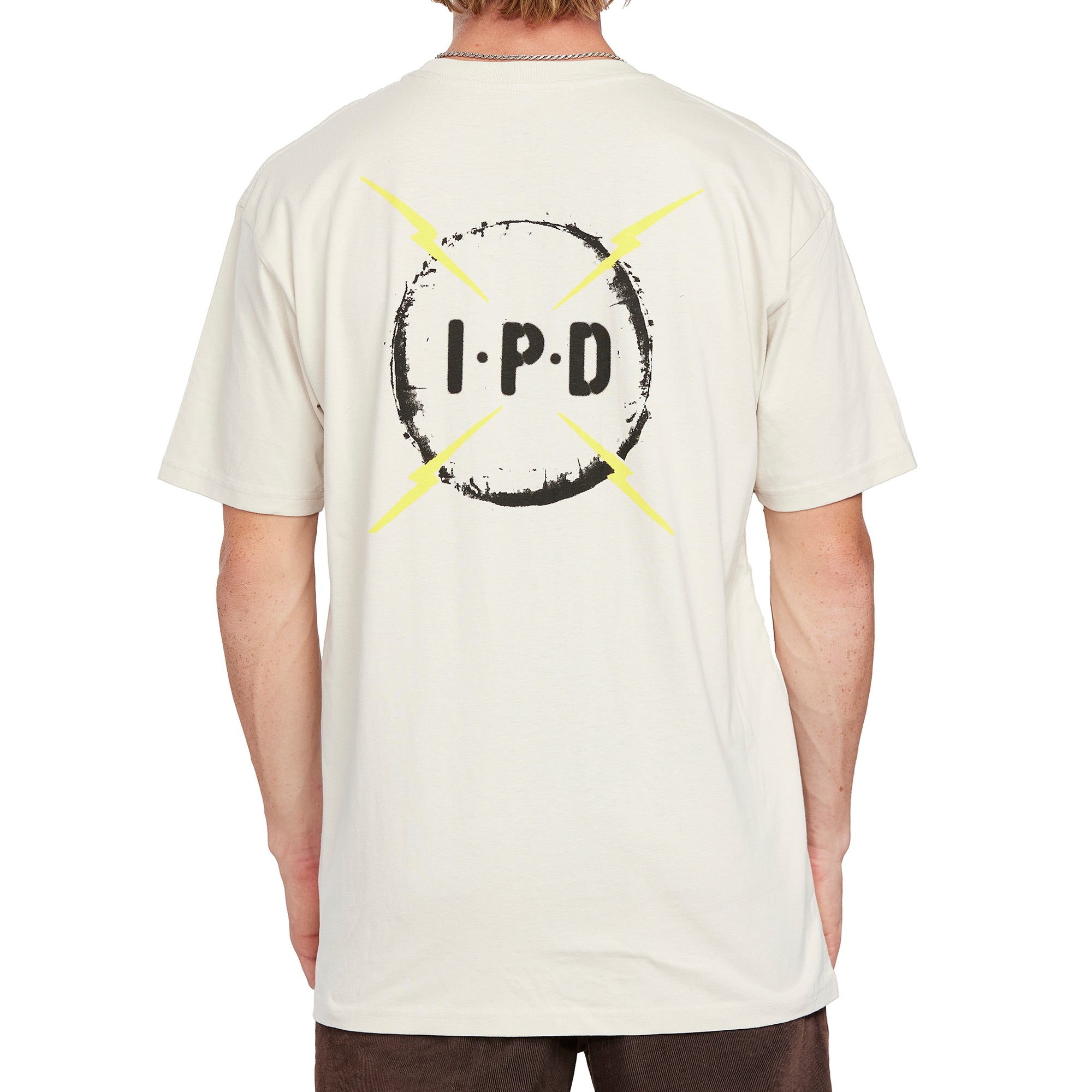 Back view of the cream Bolt Short Sleeve Tee showing the large IPD logo with four bold lightning bolts on the back.