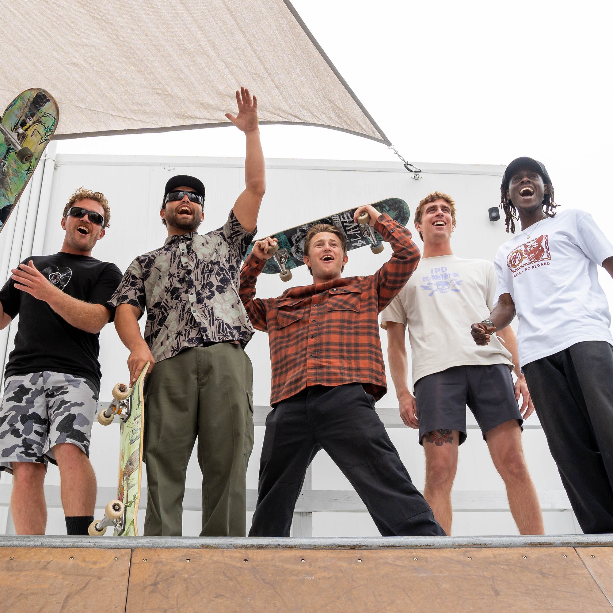 Group of Skateboarders Enjoying a Day on the Skate Ramp - Outdoor Fun and Skateboarding Lifestyle