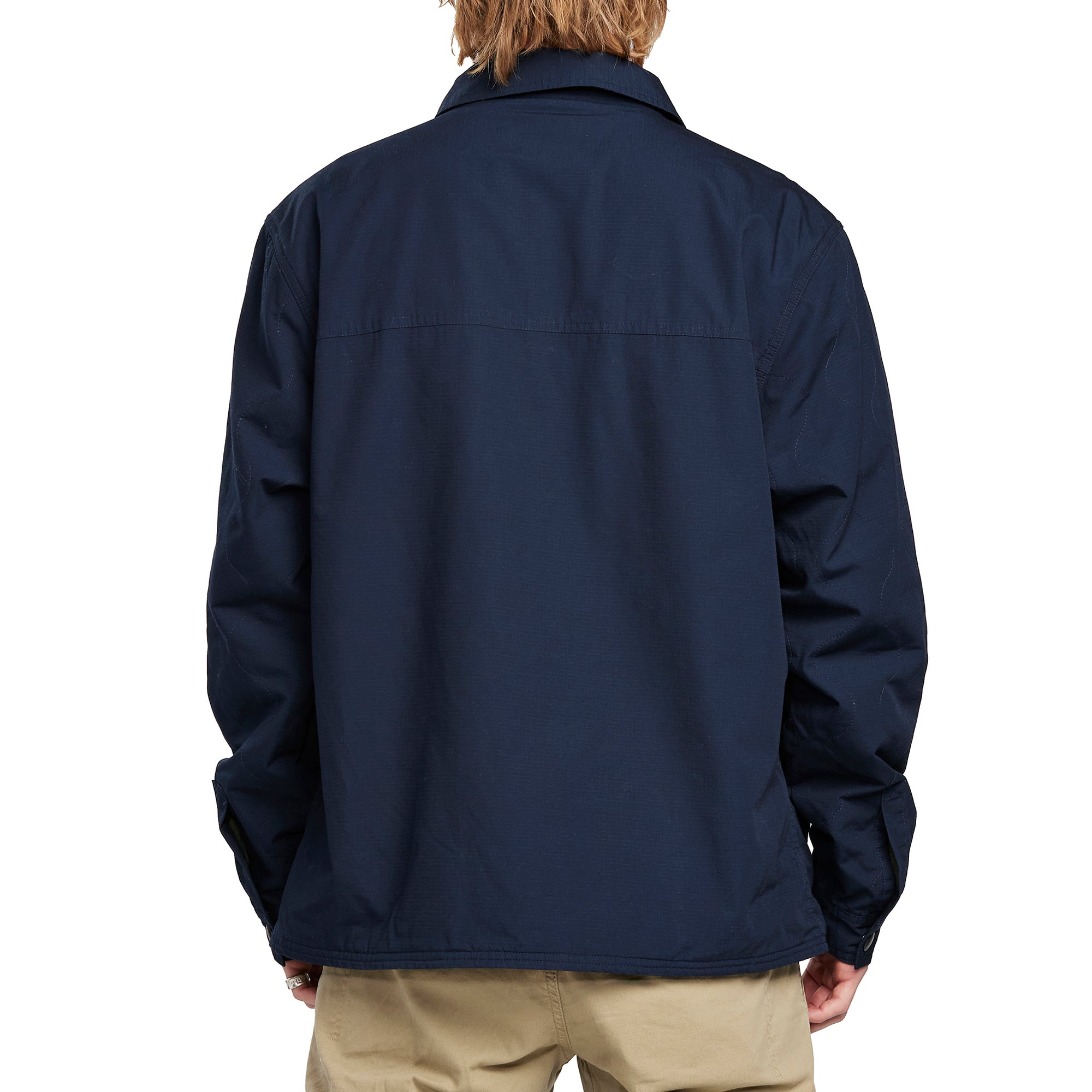 Back view of a man wearing the IPD Dispatch jacket.