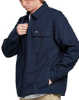 Side view of a man wearing the IPD Dispatch jacket, showing the practical pockets.