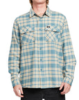 Front view of a man wearing the IPD Evergreen flannel shirt in blue with a plaid pattern.