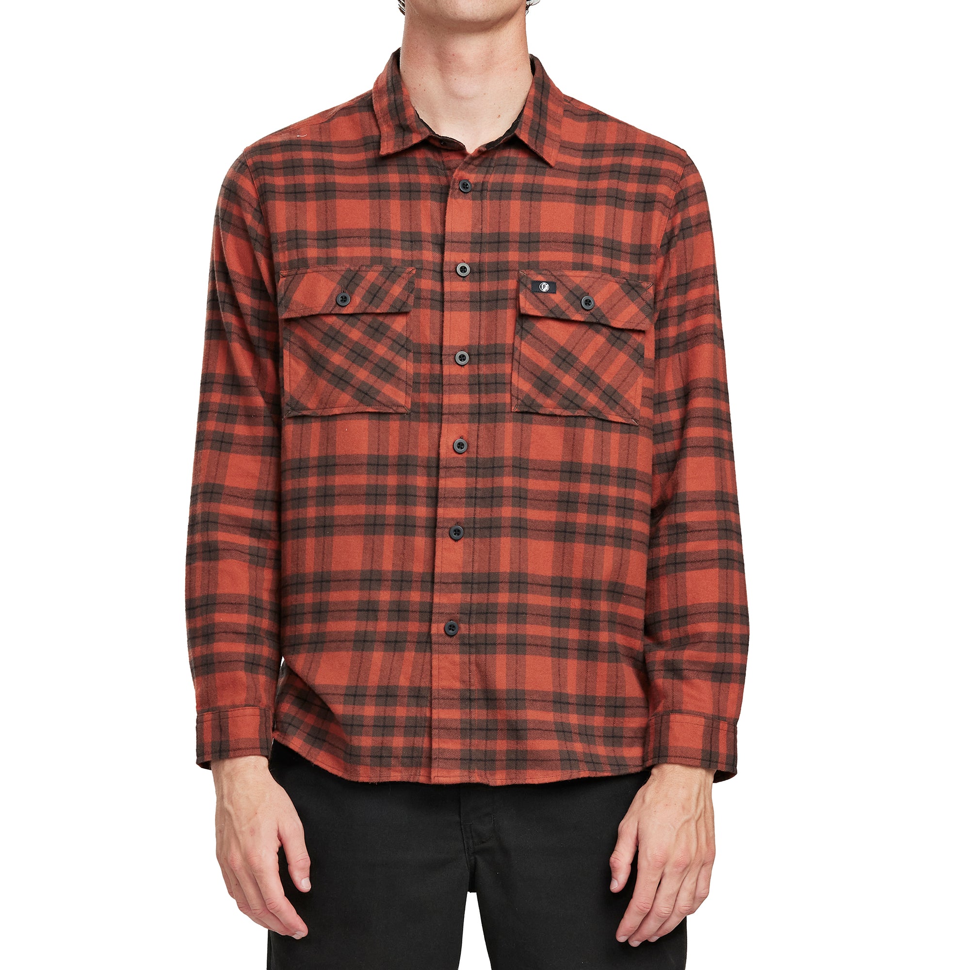 Front view of a man wearing the IPD Evergreen flannel shirt in burnt orange with a plaid pattern.