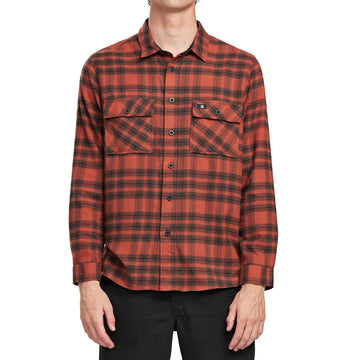 Front view of a man wearing the IPD Evergreen flannel shirt in blue with a plaid pattern.