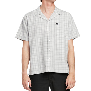 Front view of a man wearing the IPD Knox short sleeve shirt with a subtle plaid pattern.