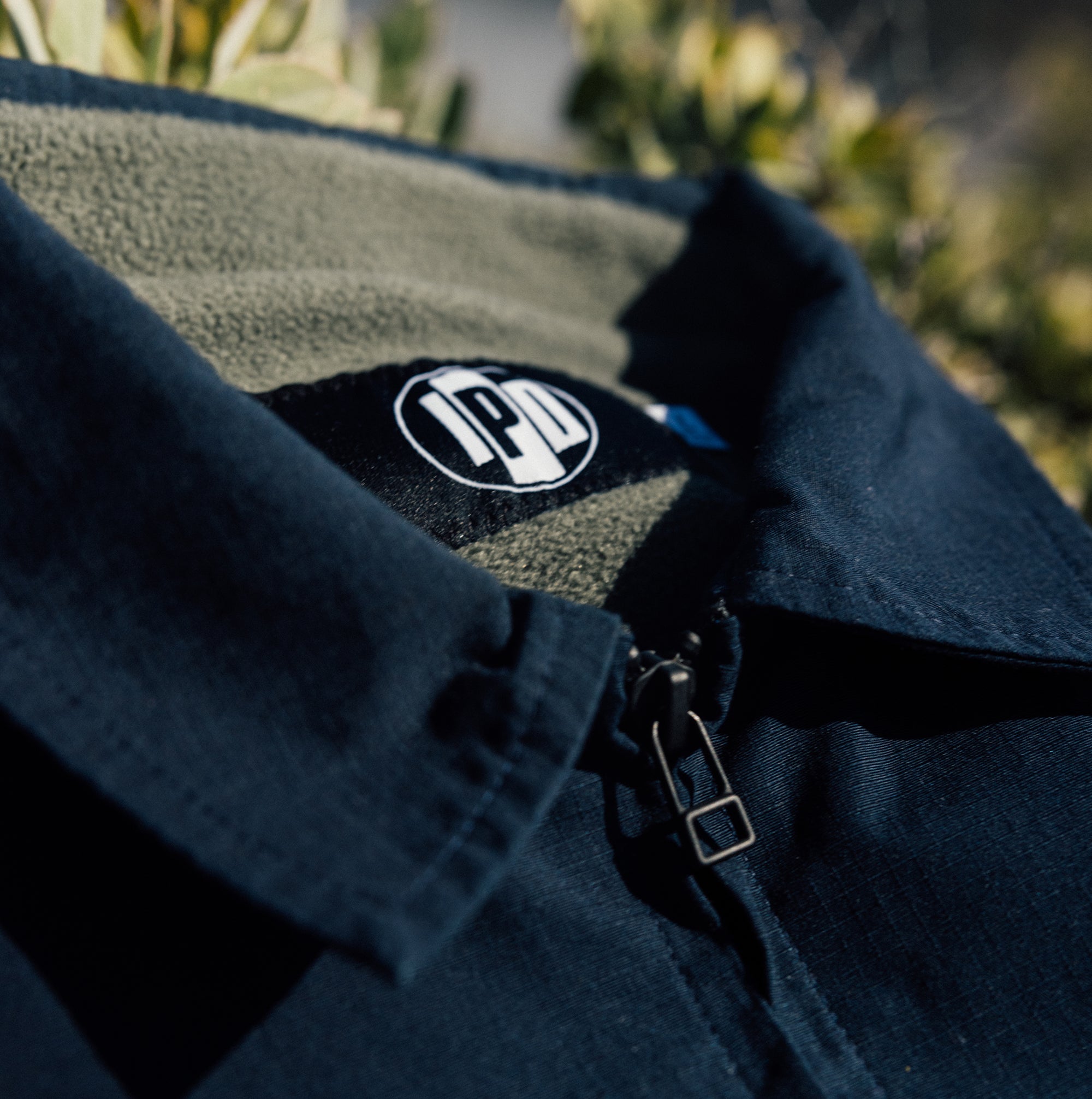 Detailed view of the IPD jacket's interior logo and fleece lining