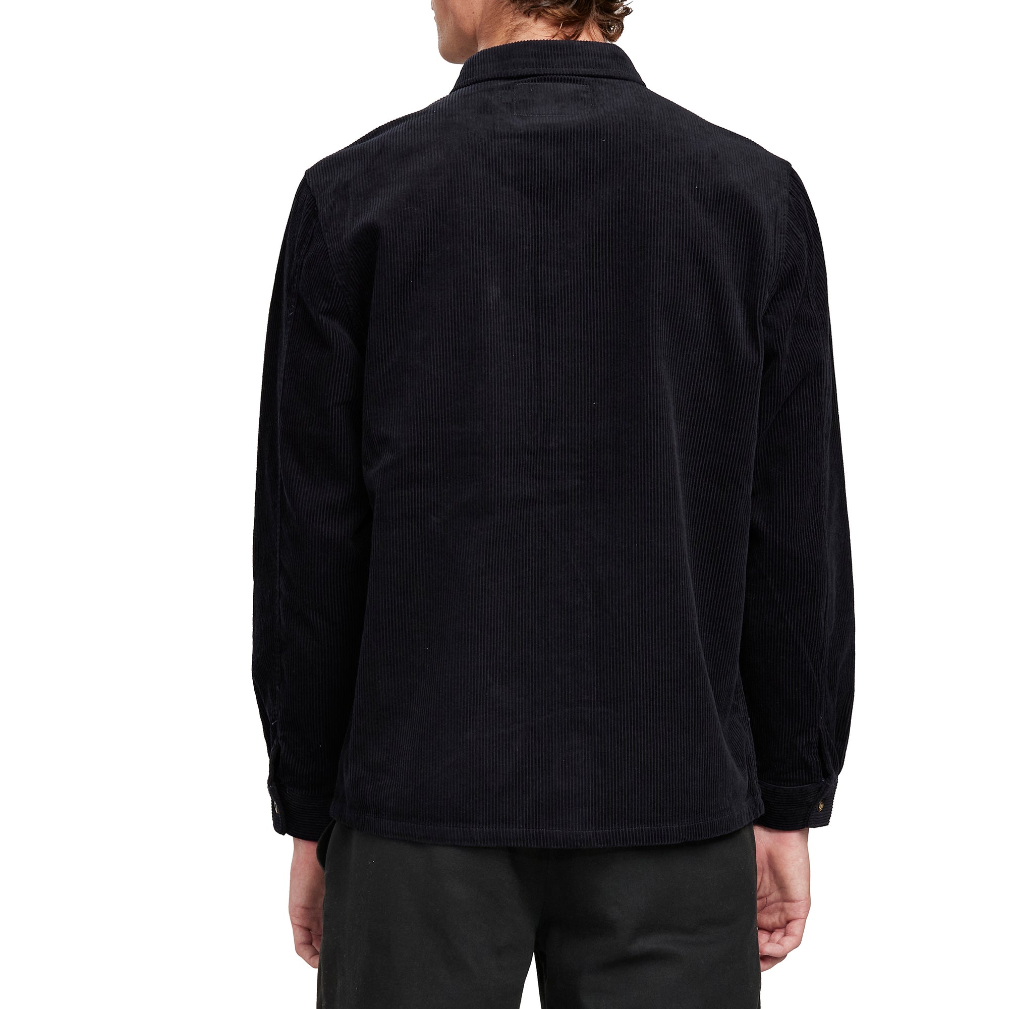 Back view of a man wearing the IPD Pierside corduroy shirt in black.