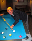 Man playing pool wearing the IPD Pierside corduroy shirt in black.