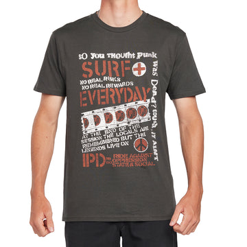 Front view of white IPD Surf Everyday graphic tee featuring bold typography and punk rock-inspired design in dark olive. Made from 100% combed ring-spun cotton for ultra-soft comfort.