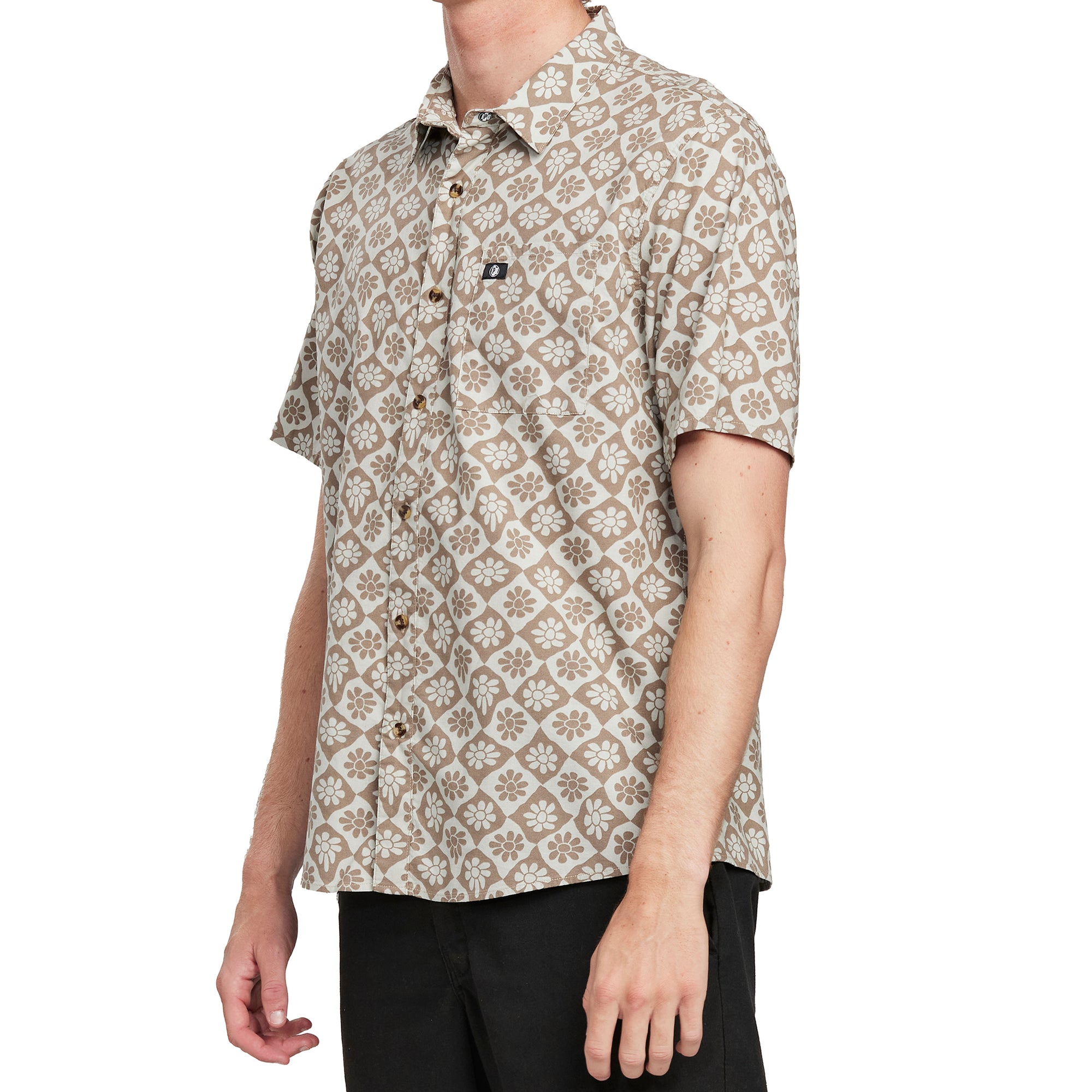 Side view of a man wearing the IPD Rudy short sleeve woven shirt, showing the floral pattern.