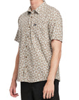 Side view of a man wearing the IPD Rudy short sleeve woven shirt, showing the floral pattern.