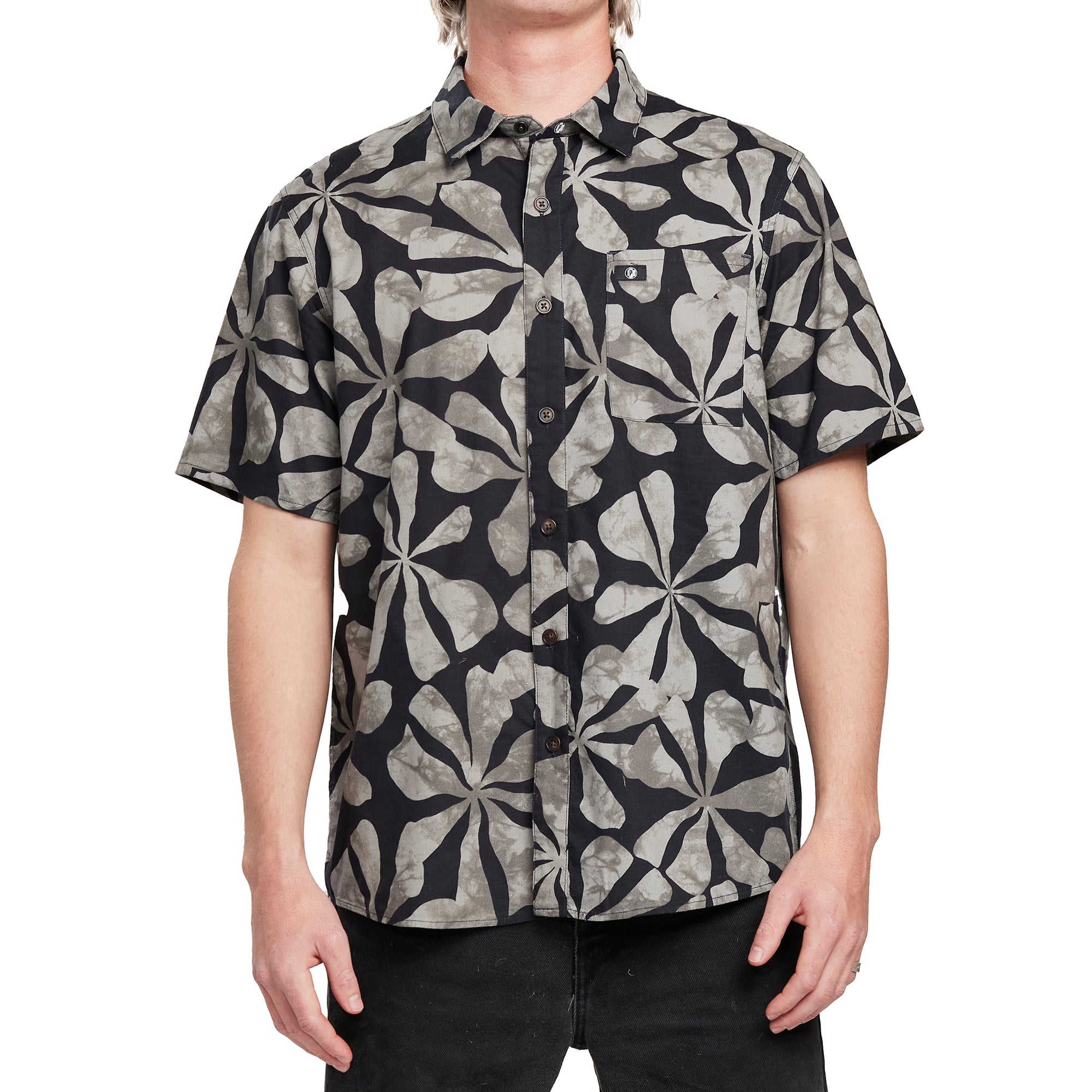 Front view of a man wearing the IPD Spinner short sleeve woven shirt with a black and gray floral pattern.