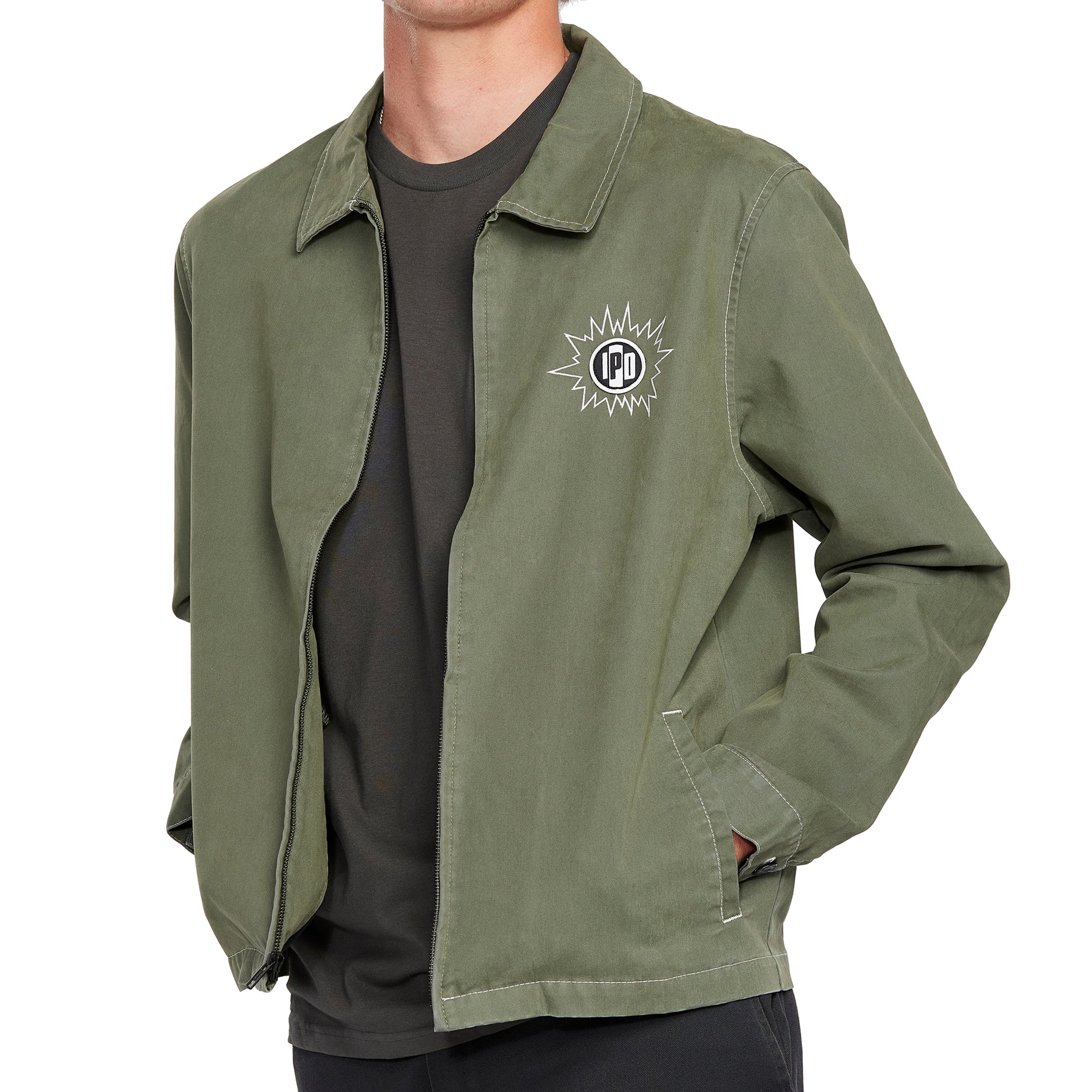 Side view of an olive green zip-up jacket with a relaxed fit and simple design, perfect for layering in any casual outfit.