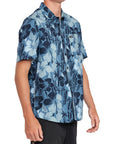 Side view of a Pacific blue Hawaiian print short sleeve shirt showcasing its detailed black and white floral design and comfortable fi