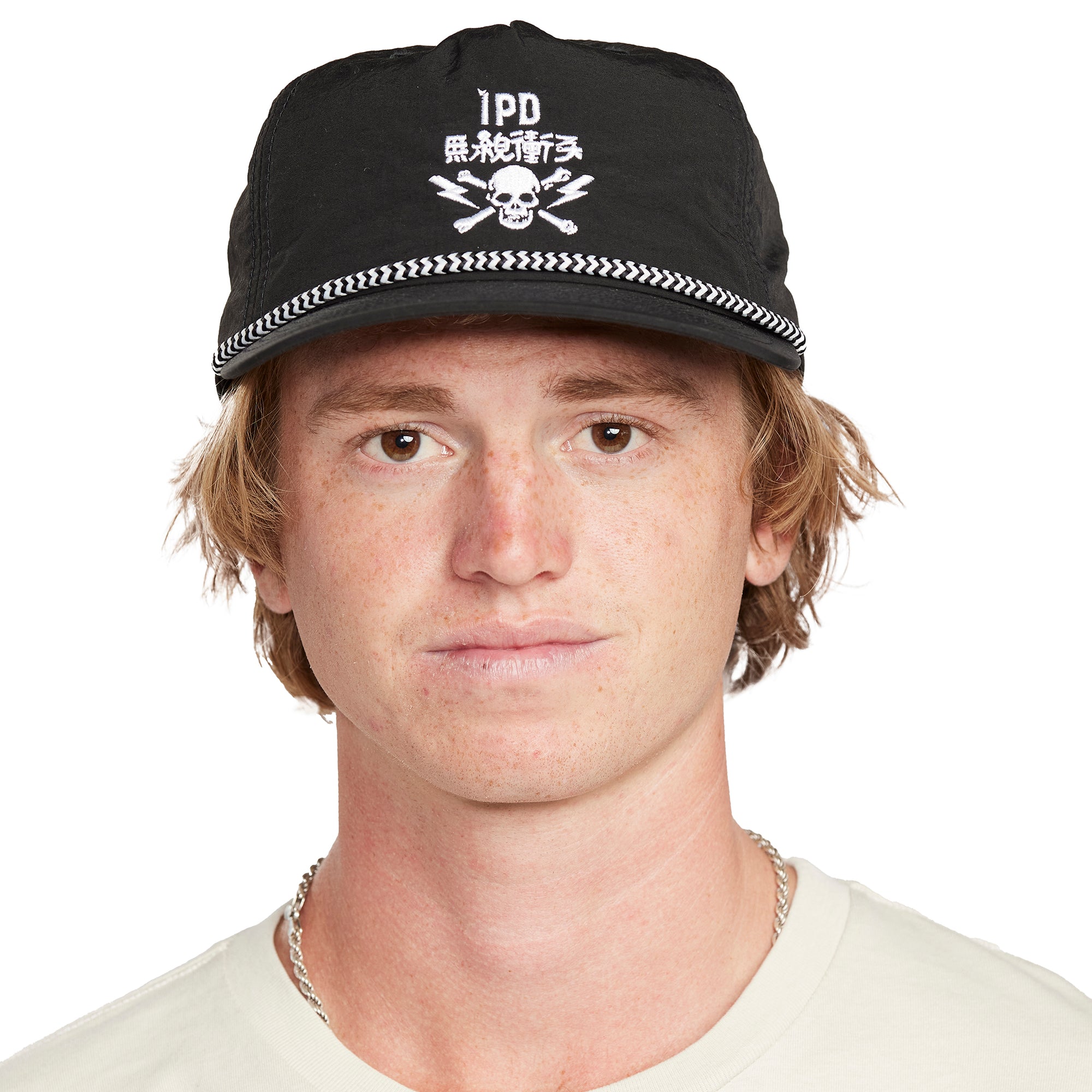 Strummer Nylon Snapback - Front View | Lightweight Nylon Snapback Hat with Embroidered Skull and Crossbones Design