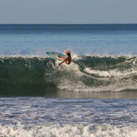 tomy in the middle of a nice frontside turn right on the lip of a wave