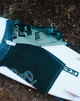 mens faceplant y2k fit 22" boardshort showing the front view and graphics as they lay on surfboard 