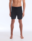 The B100 Chase boardshort features a 16” length and solid black coloring with a black and white striped side taping. It also has a waistband tie, side zipper pocket, and a black IPD logo patch halfway up the left leg taping.