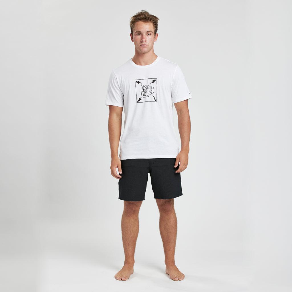 model wearing mens bolt short sleeve tee in white showing the large tiger head logo with four lightening bolts surrounded by square 