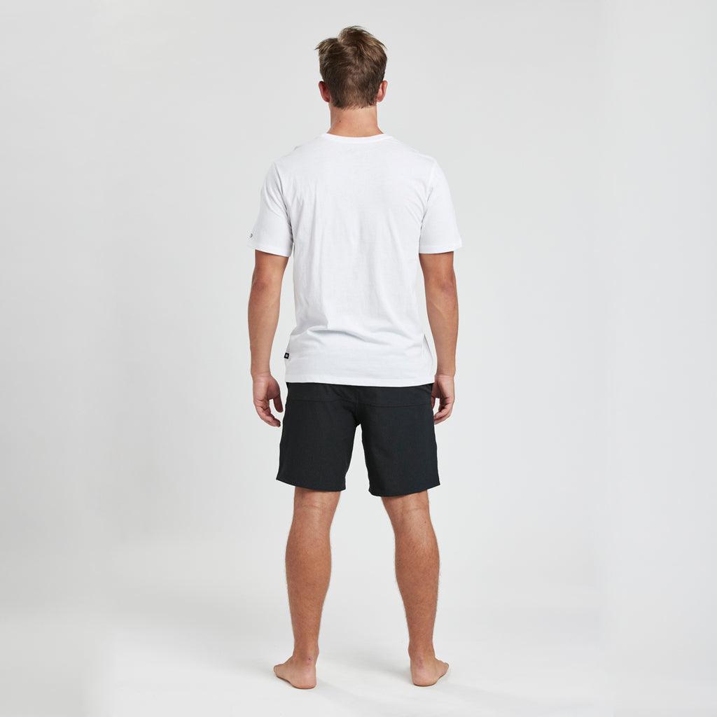model wearing mens bolts short sleeve tee in white showing plain back of shirt