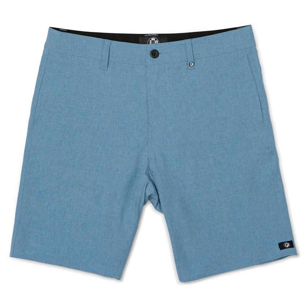 front view of mens carter hydrid walkshort in banjo blue - has belt loops along waistband and black button for closure along with small ipd circular logo on left leg hem 
