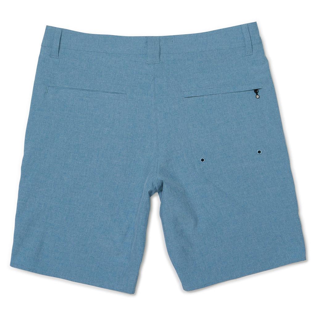 rear view of mens carter hybrid walkshort in banjo blue showing two rear pockets one with zipper closure and one without along with belt loops along waist 