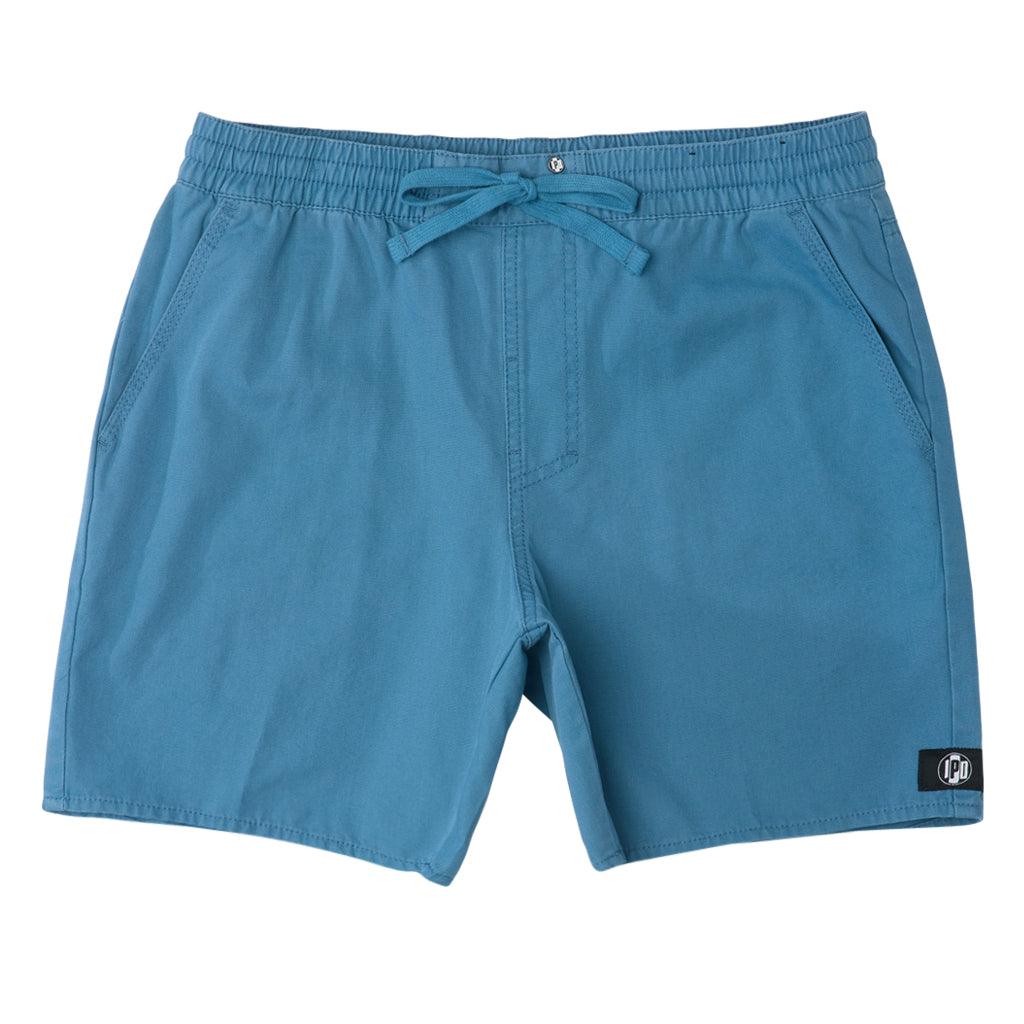 The Foundation Walkshort is a classic walkshort silhouette that comes in at a 17” length. It features a solid blue coloring, and features an elastic waistband and drawcord. The pocketing is two side pockets and two back patch pockets. It features the signature smaller IPD flag label on the lower left leg.