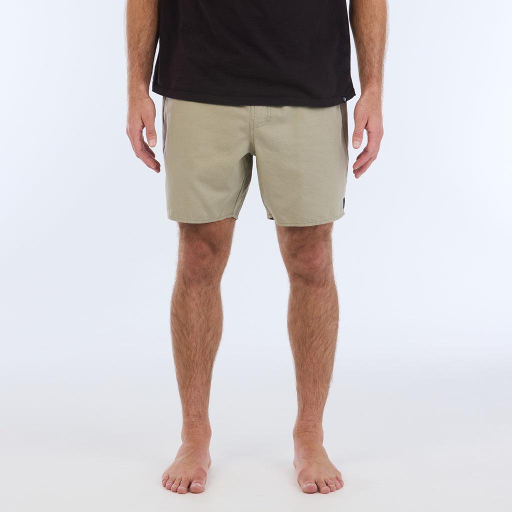 on model with black top:The Foundation Walkshort is a classic walkshort silhouette that comes in at a 17” length. It features a solid gray coloring, and features an elastic waistband and drawcord. The pocketing is two side pockets and two back patch pockets. It features the signature smaller IPD flag label on the lower left leg.