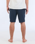 The Carter Hybrid features a 19” length in a classic walkshort silhouette in a waterproof fabric. The base color of the short is a heathered navy. The short also features belt loops, a zipper and button closure, two side pockets and two back pockets, and the signature smaller IPD flag label on the lower left leg.