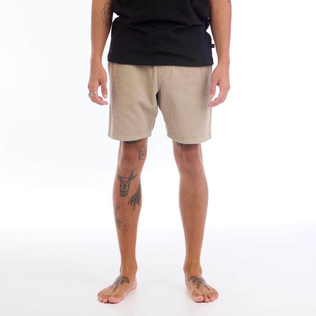 The Wales short is an 18” walkshort that features a corduroy fabric in the color dune gray and an elastic waistband built to hug your waist. The short features a waistband tie, two front and back pockets, and a black IPD label on the back right pocket.