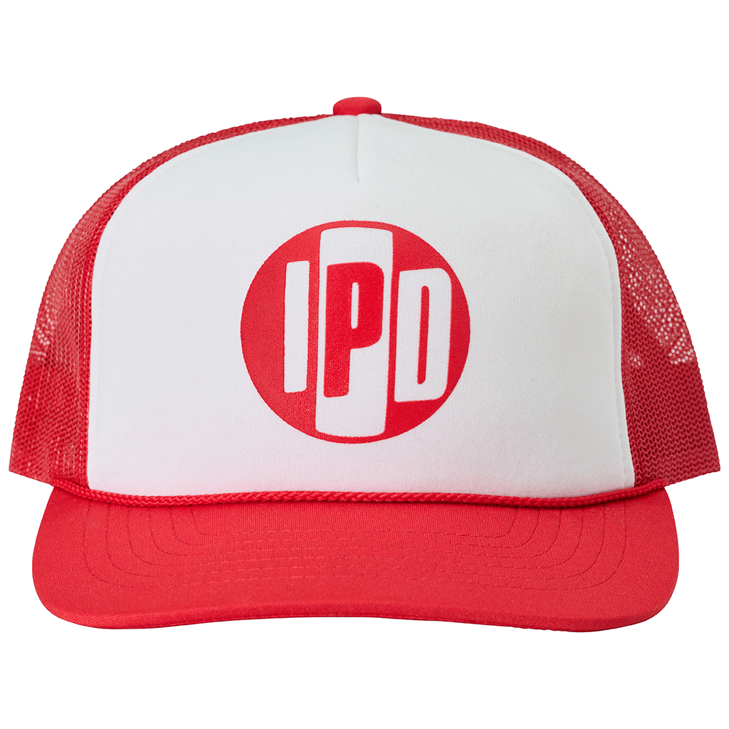 The classic trucker style and shape. This hat is solid navy blue and has our Iconic IPD logo on the front in green. Nylon foam front material, nylon mesh back, flat bill, rope detail, heat transfer logo, adjustable snap back.